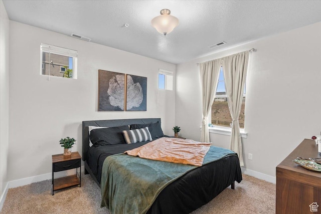 4192 W Mckellen Dr Unit B2, Herriman, UT 84096 - bedroom featuring light colored carpet, baseboards, and a textured ceiling