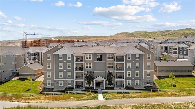 4192 W Mckellen Dr Unit B2, Herriman, UT 84096 - view of building exterior featuring a residential view and a mountain view