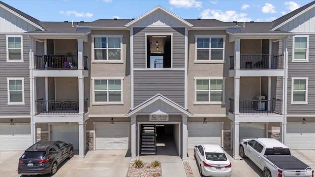4192 W Mckellen Dr Unit B2, Herriman, UT 84096 - multi unit property with board and batten siding, an attached garage, driveway, and stone siding