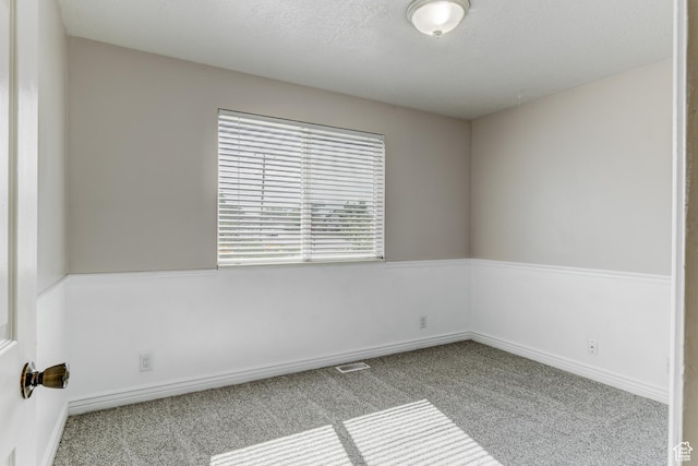 4799 S 3900 W, Roy, UT 84067 - unfurnished room with carpet floors, a textured ceiling, and baseboards