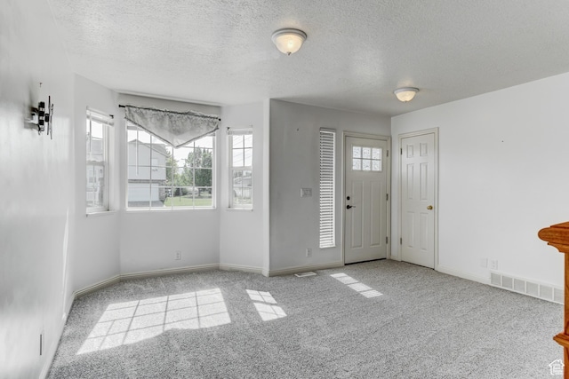 4799 S 3900 W, Roy, UT 84067 - carpeted entrance foyer with a textured ceiling and baseboards