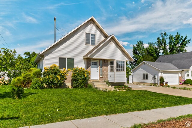 4799 S 3900 W, Roy, UT 84067 - view of front facade with a front yard and concrete driveway