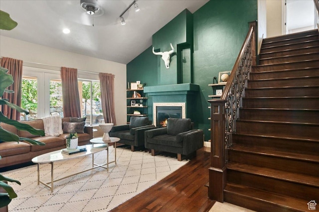 4280 S Scenic Cir E, Bountiful, UT 84010 - living room featuring lofted ceiling, hardwood / wood-style floors, stairway, a glass covered fireplace, and a ceiling fan
