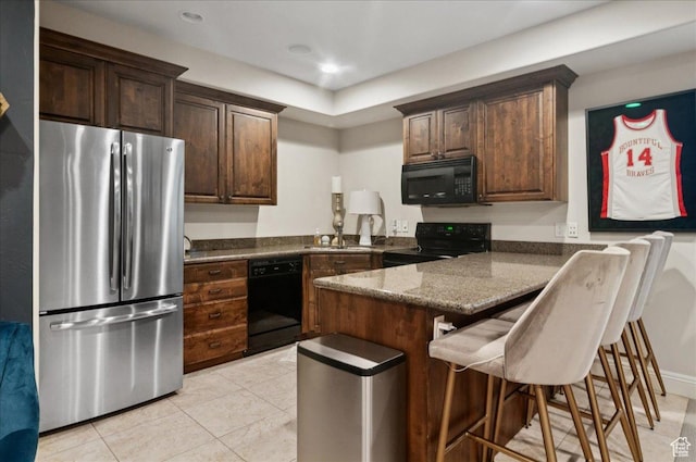 4280 S Scenic Cir E, Bountiful, UT 84010 - kitchen featuring black appliances, a sink, a peninsula, a kitchen breakfast bar, and dark stone counters