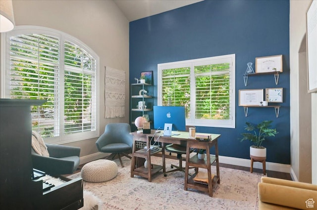 4280 S Scenic Cir E, Bountiful, UT 84010 - office area featuring wood finished floors, baseboards, healthy amount of natural light, and high vaulted ceiling
