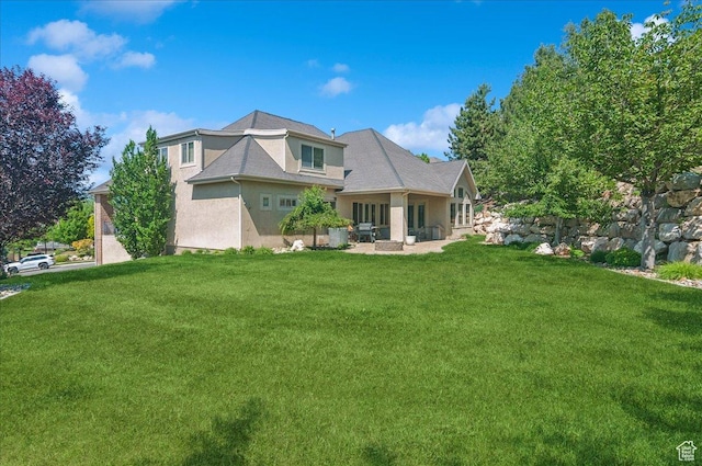 4280 S Scenic Cir E, Bountiful, UT 84010 - back of house featuring stucco siding and a lawn