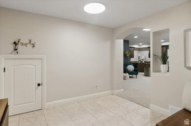 4280 S Scenic Cir E, Bountiful, UT 84010 - entrance foyer with arched walkways, light tile patterned flooring, light carpet, baseboards, and recessed lighting
