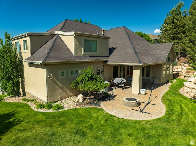 4280 S Scenic Cir E, Bountiful, UT 84010 - rear view of property featuring stucco siding, an outdoor fire pit, a patio area, and a yard
