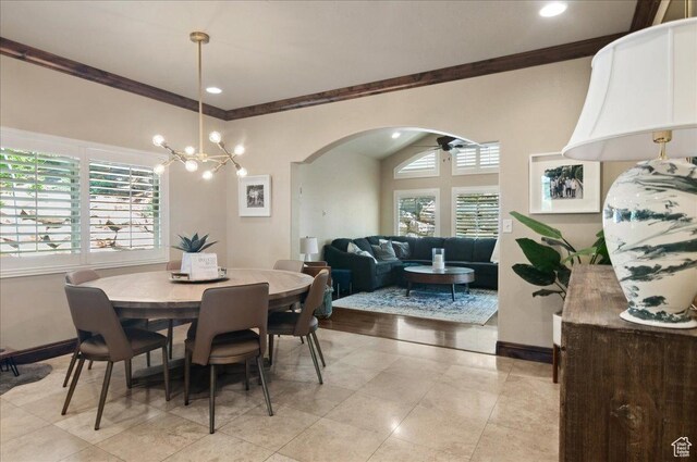 4280 S Scenic Cir E, Bountiful, UT 84010 - dining area with ornamental molding, arched walkways, a chandelier, baseboards, and a ceiling fan