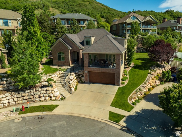 4280 S Scenic Cir E, Bountiful, UT 84010 - view of front of house with stairs, brick siding, concrete driveway, a garage, and a front yard