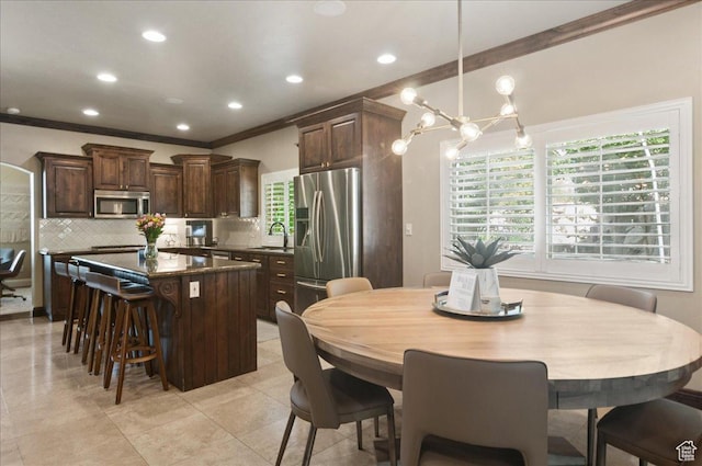 4280 S Scenic Cir E, Bountiful, UT 84010 - dining area with ornamental molding, recessed lighting, and a chandelier