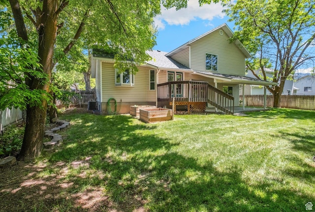 1553 N 1525 E, Logan, UT 84341 - rear view of house featuring a deck, a garden, and central air condition unit