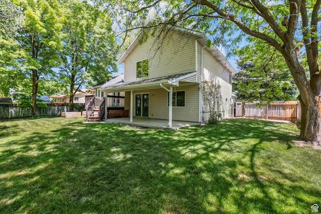 1553 N 1525 E, Logan, UT 84341 - rear view of property with a patio area and a wooden deck