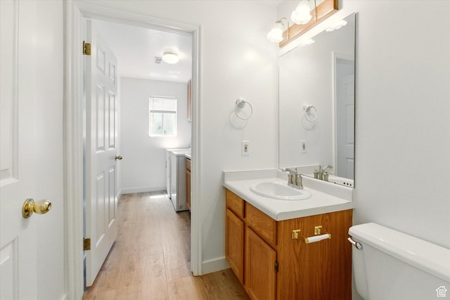 1553 N 1525 E, Logan, UT 84341 - bathroom with vanity, wood finished floors, and toilet