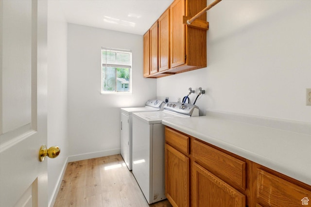 1553 N 1525 E, Logan, UT 84341 - laundry area with cabinet space, light wood finished floors, washer and dryer, and baseboards