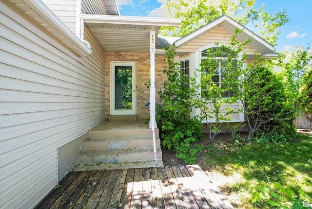 1553 N 1525 E, Logan, UT 84341 - view of exterior entry with brick siding and a deck