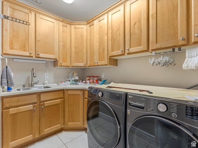 5767 S Erekson Ln, Murray, UT 84107 - laundry room with washing machine and clothes dryer, cabinet space, and light tile patterned floors