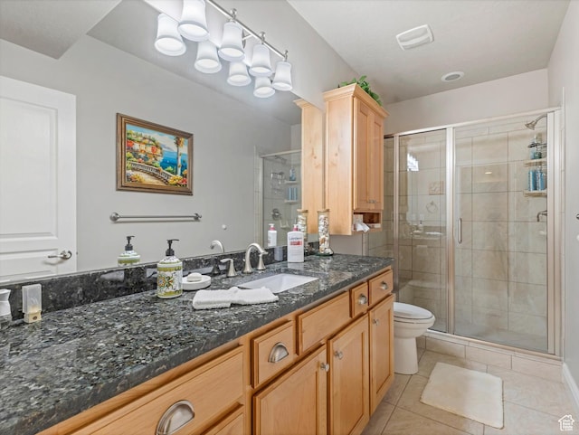 5767 S Erekson Ln, Murray, UT 84107 - bathroom featuring tile patterned flooring, vanity, a shower stall, and toilet