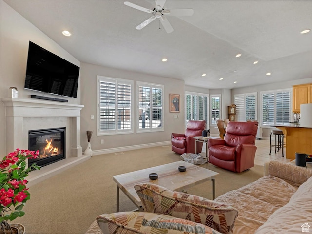 5767 S Erekson Ln, Murray, UT 84107 - living room with light colored carpet, recessed lighting, baseboards, a premium fireplace, and ceiling fan