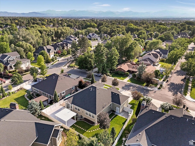 5767 S Erekson Ln, Murray, UT 84107 - aerial overview of property's location with nearby suburban area, mountains, and a heavily wooded area