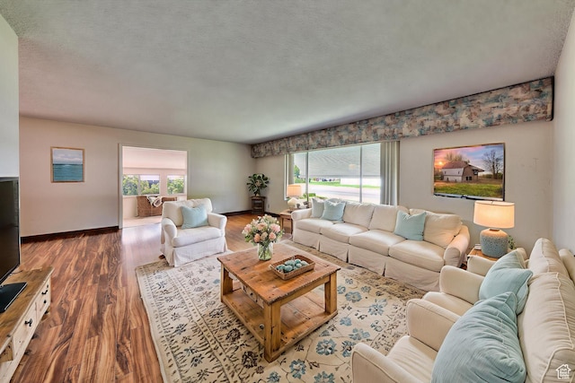 630 N 500 W, Moab, UT 84532 - living room featuring wood finished floors, baseboards, and a textured ceiling
