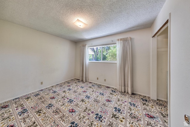 630 N 500 W, Moab, UT 84532 - unfurnished bedroom featuring a textured ceiling
