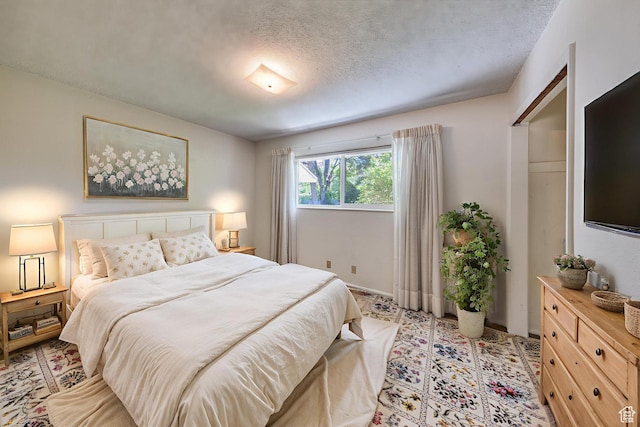 630 N 500 W, Moab, UT 84532 - bedroom featuring a textured ceiling and baseboards