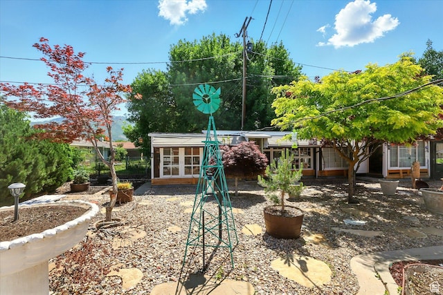 5226 S 200 W, Washington Terrace, UT 84405 - rear view of house featuring french doors