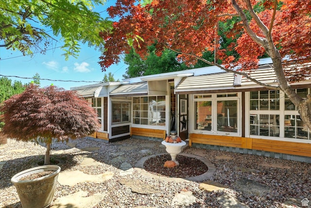 5226 S 200 W, Washington Terrace, UT 84405 - rear view of house featuring a sunroom