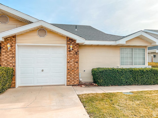 2051 W Canyon View Dr S, St George, UT 84770 - ranch-style home with driveway, an attached garage, roof with shingles, and brick siding