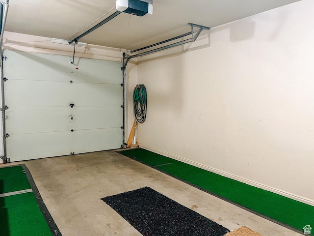 2051 W Canyon View Dr S, St George, UT 84770 - garage featuring a garage door opener and baseboards