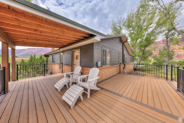 7020 E Creekside Ln, Castle Valley, UT 84532 - wooden terrace featuring a mountain view