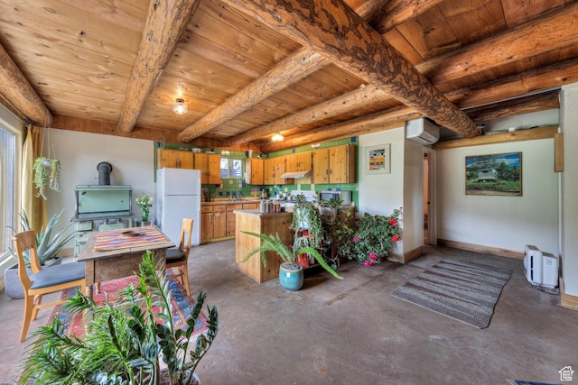 7020 E Creekside Ln, Castle Valley, UT 84532 - kitchen featuring freestanding refrigerator, wooden ceiling with exposed beams, unfinished concrete flooring, under cabinet range hood, and a wood stove