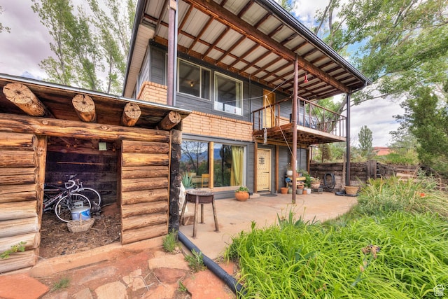 7020 E Creekside Ln, Castle Valley, UT 84532 - rear view of property featuring a patio and a balcony