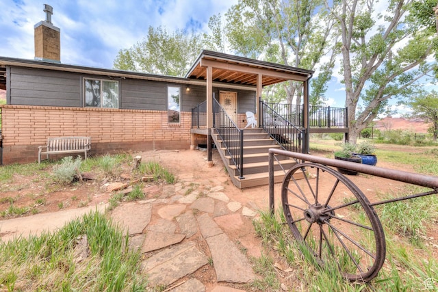 7020 E Creekside Ln, Castle Valley, UT 84532 - view of front of property with a chimney