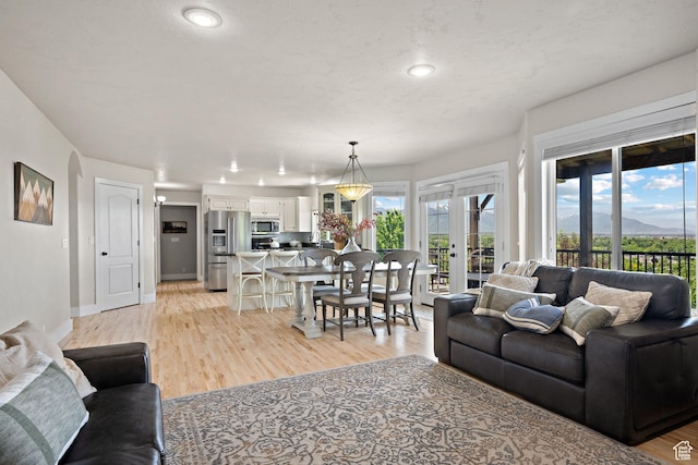 663 N 880 E, Springville, UT 84663 - living area with light wood-type flooring, recessed lighting, and a mountain view