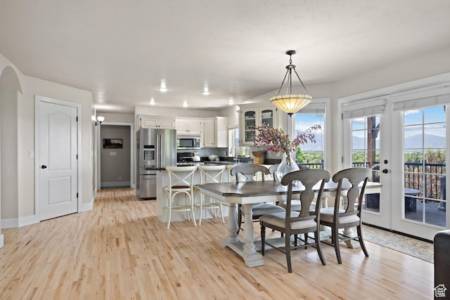 663 N 880 E, Springville, UT 84663 - dining space featuring light wood finished floors, baseboards, and french doors