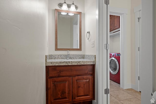 11066 S Becks Ln, South Jordan, UT 84095 - bathroom featuring washer / dryer, tile patterned floors, vanity, and baseboards