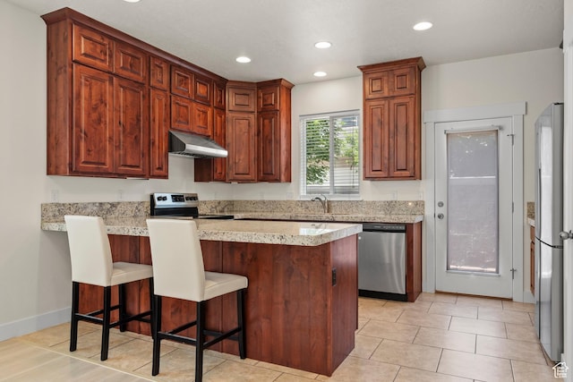 11066 S Becks Ln, South Jordan, UT 84095 - kitchen with stainless steel appliances, range hood, a peninsula, a kitchen breakfast bar, and a sink
