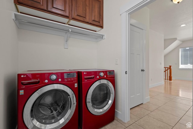 11066 S Becks Ln, South Jordan, UT 84095 - laundry area with washing machine and clothes dryer, cabinet space, light tile patterned floors, and baseboards