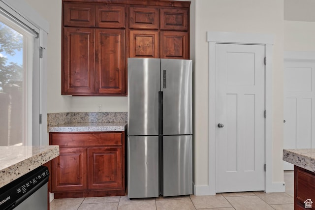 11066 S Becks Ln, South Jordan, UT 84095 - kitchen with stainless steel appliances, light tile patterned floors, and light stone counters