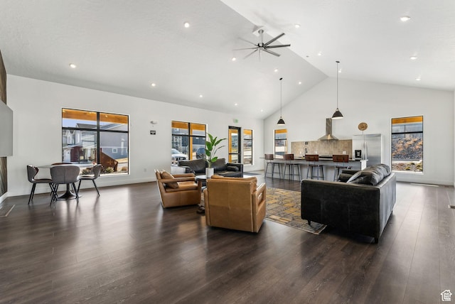 8518 W Cordero Dr, Magna, UT 84044 - living area featuring dark wood-type flooring, high vaulted ceiling, ceiling fan, recessed lighting, and baseboards