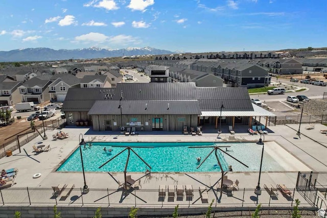8518 W Cordero Dr, Magna, UT 84044 - community pool with a residential view, a patio, and a mountain view