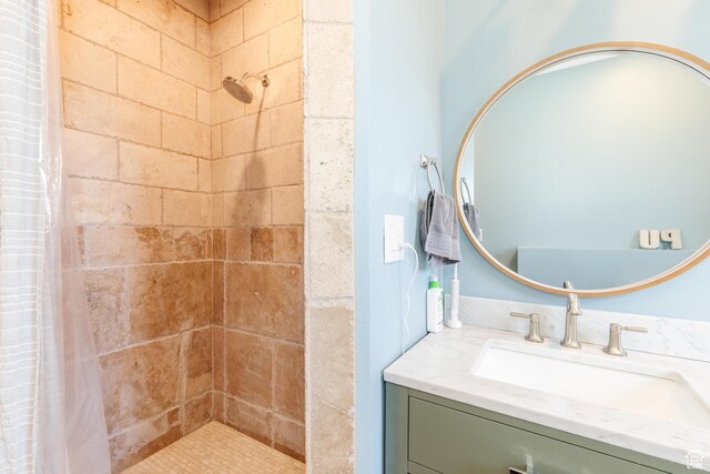 761 S Lakeview Dr, Garden City, UT 84028 - bathroom featuring a tile shower and vanity