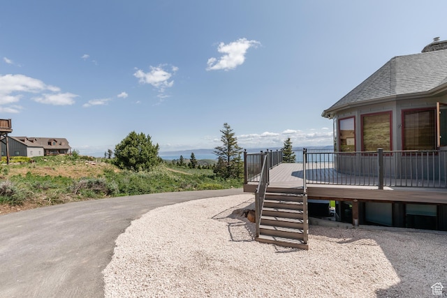 761 S Lakeview Dr, Garden City, UT 84028 - view of yard featuring a deck and a carport