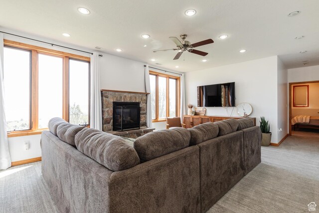 761 S Lakeview Dr, Garden City, UT 84028 - living area with baseboards, a stone fireplace, light colored carpet, recessed lighting, and healthy amount of natural light