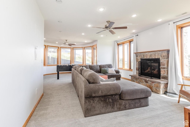 761 S Lakeview Dr, Garden City, UT 84028 - living area featuring recessed lighting, baseboards, a stone fireplace, a ceiling fan, and healthy amount of natural light