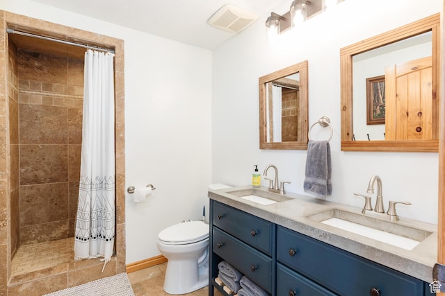 761 S Lakeview Dr, Garden City, UT 84028 - full bathroom featuring double vanity, toilet, tiled shower, and tile patterned floors