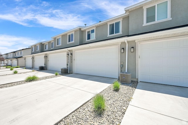 8622 W Cordero Dr S Unit 1170, Magna, UT 84044 - multi unit property featuring stucco siding, an attached garage, concrete driveway, and central AC unit