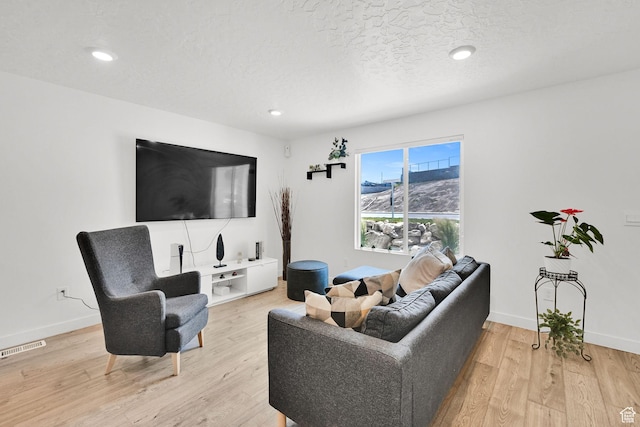 8622 W Cordero Dr S Unit 1170, Magna, UT 84044 - living area with light wood-type flooring, baseboards, and recessed lighting